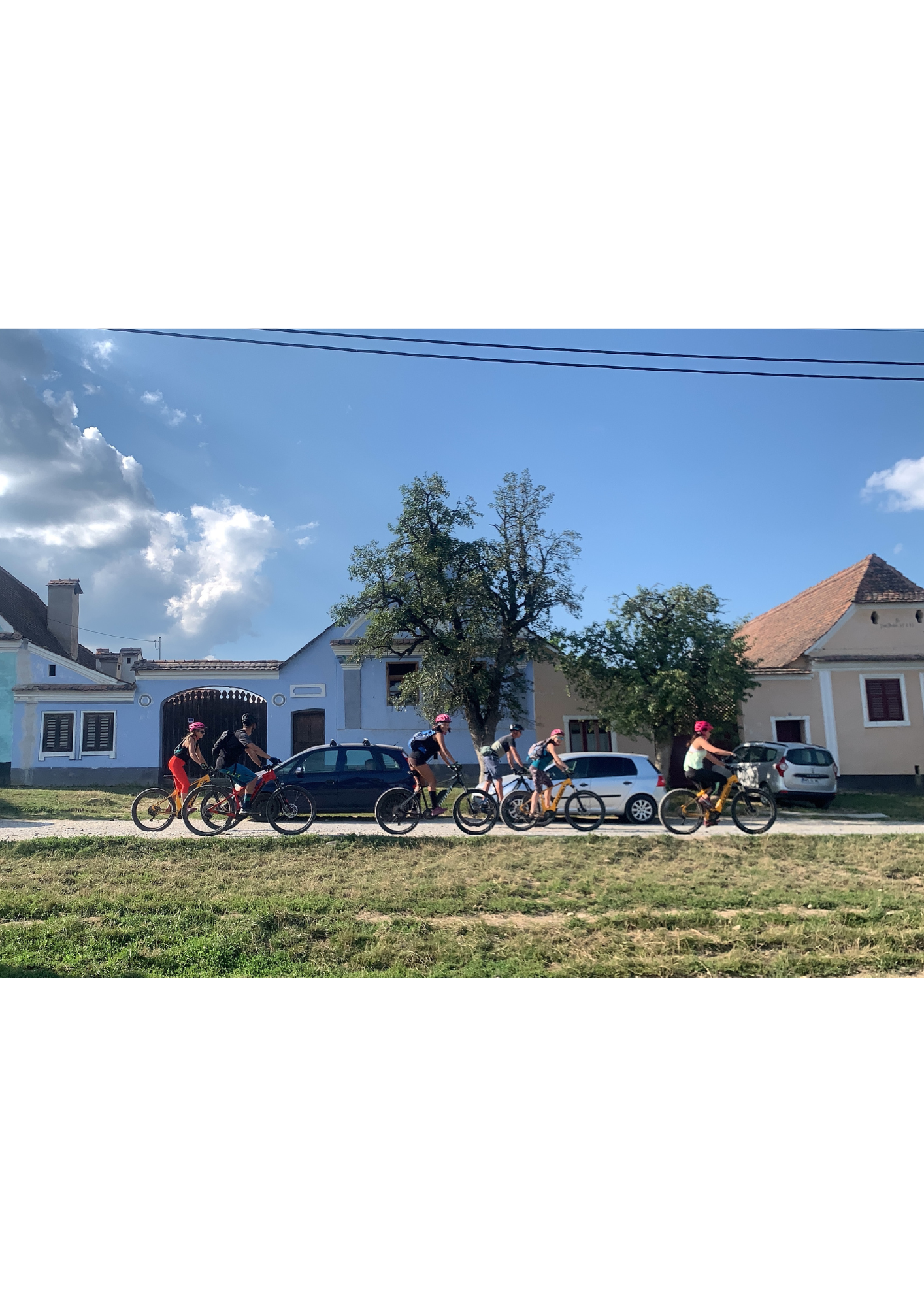 Group of cyclists resting near a Saxon village